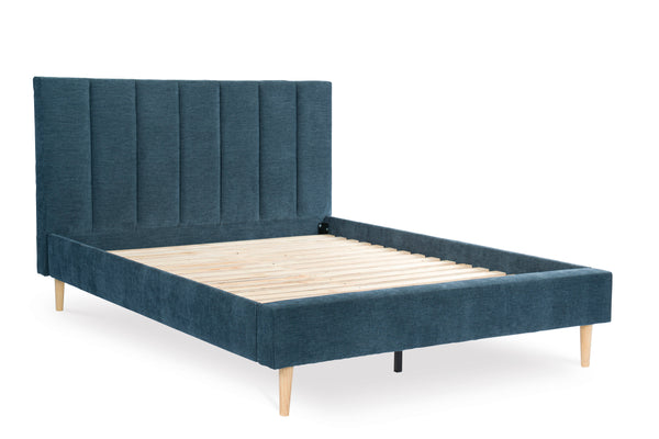 Blue upholstered bed with wooden slats on a white background
